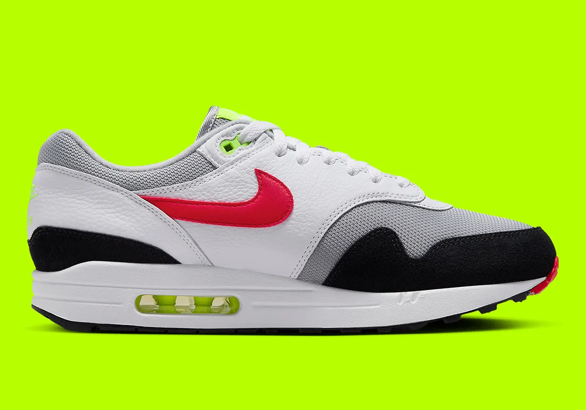 Nike Air Max 1 Chili Volt, sneaker Nike Air Max 1 avec coloris Chili et Volt, amorti Nike Air visible et finitions premium.