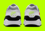 Nike Air Max 1 Chili Volt, sneaker Nike Air Max 1 avec coloris Chili et Volt, amorti Nike Air visible et finitions premium.