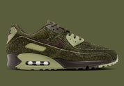 Sneakers Nike Air Max 90 Premium Skunk vert foncé en matières premium texturées avec unité Air visible et design iconique