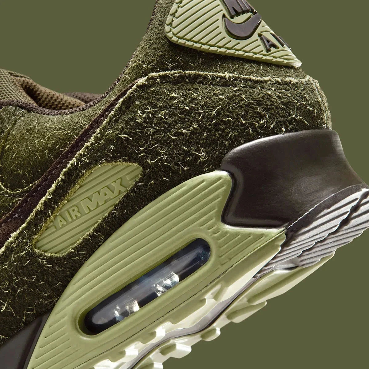 Sneakers Nike Air Max 90 Premium Skunk vert foncé en matières premium texturées avec unité Air visible et design iconique