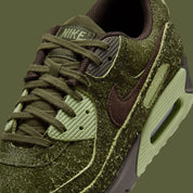 Sneakers Nike Air Max 90 Premium Skunk vert foncé en matières premium texturées avec unité Air visible et design iconique