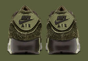 Sneakers Nike Air Max 90 Premium Skunk vert foncé en matières premium texturées avec unité Air visible et design iconique
