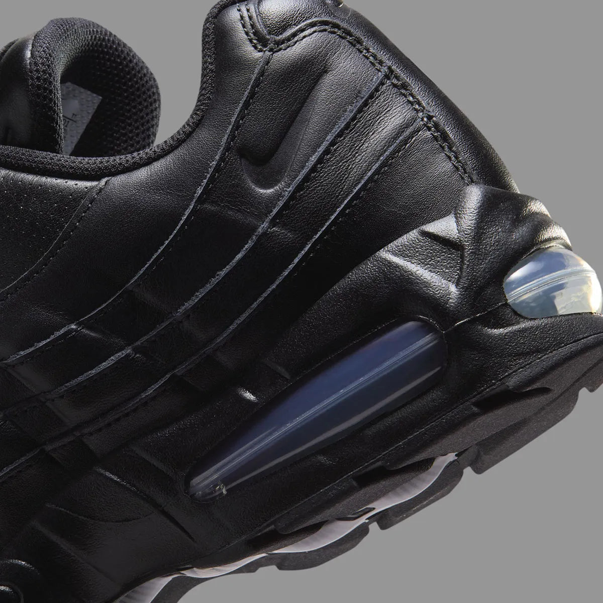 Sneakers Nike Air Max 95 QS noires en cuir premium avec unité Air Max Big Bubble visible et design iconique
