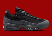 Nike Air Max 95 Smoke Grey DH9792-100, sneaker grise et blanche avec détails rouges, motifs japonais et unités Nike Air visibles.