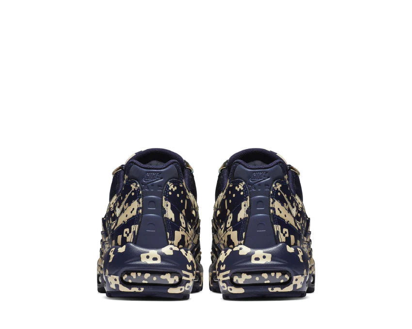 Sneakers Nike Air Max 95 Cavaliers Empt Blackened Blue en mesh technique sombre avec unités Air visibles et design ondulé iconique.Vue arrière 