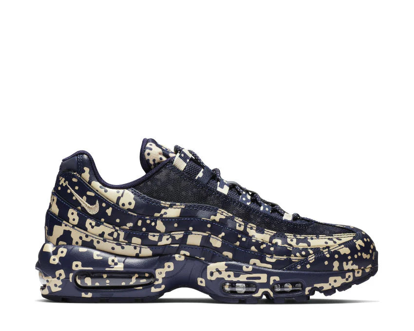Sneakers Nike Air Max 95 Cavaliers Empt Blackened Blue en mesh technique sombre avec unités Air visibles et design ondulé iconique.Vue de coté 