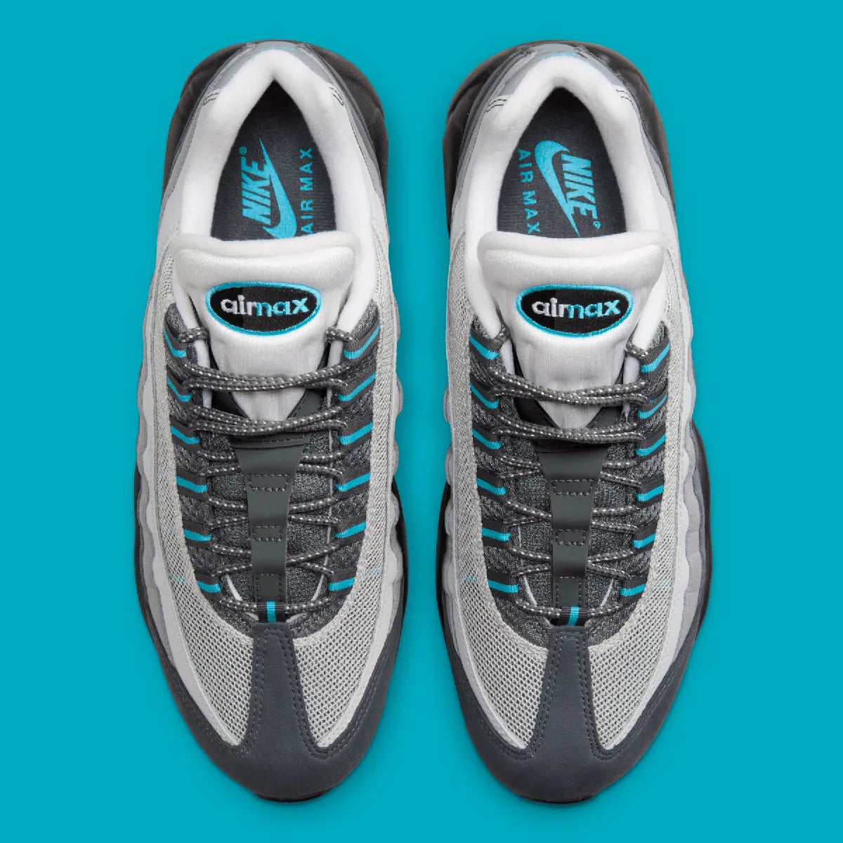 Nike Air Max 95 Baltic Blue, sneaker grise Iron Grey et Smoke Grey avec détails bleu Baltic et unités Nike Air visibles.