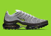 Nike Air Max Plus Neon grise et noire avec mesh dégradé, détails Neon Yellow fluorescents et unités Tuned Air visibles.