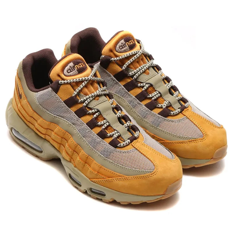 Nike Air Max 95 Wheat marron et beige avec panneaux multicouches Bronze, Baroque Brown et Bamboo et unités Air visibles.
