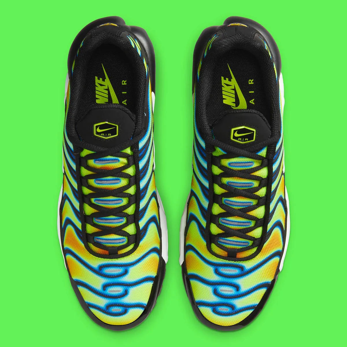 Nike Air Max Plus Heat Map, sneaker TN jaune, verte et bleue avec effet thermique, renforts noirs et unités Air visibles.