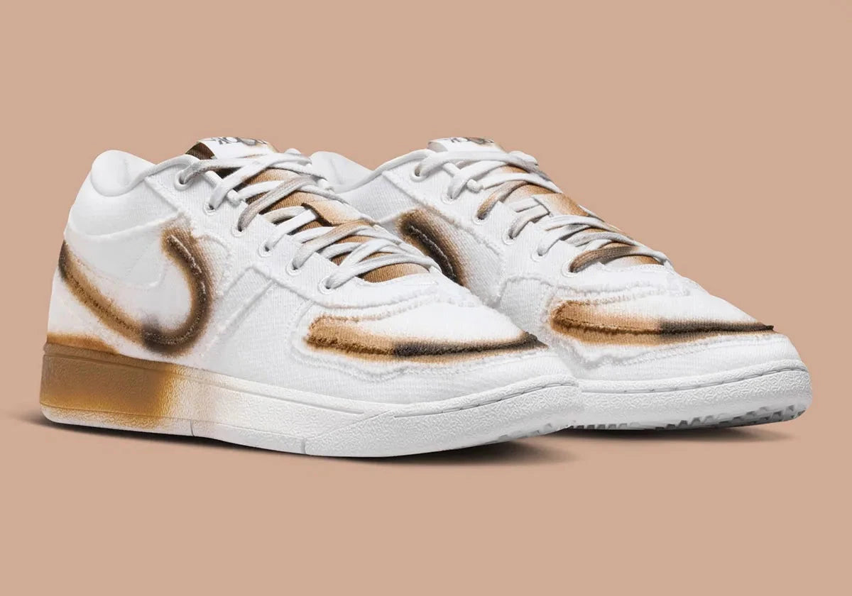 Nike Book 1 Torched à silhouette basse, avec tige multicouche aux tons chauds contrastés, empiècements structurés, amorti Zoom Air et semelle extérieure adhérente.