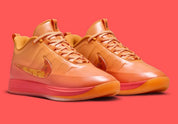 Sneakers Nike Book 2 en mesh respirant avec renforts synthétiques, coloris orange et violet Phoenix, amorti performance basketball.