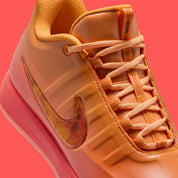 Sneakers Nike Book 2 en mesh respirant avec renforts synthétiques, coloris orange et violet Phoenix, amorti performance basketball.