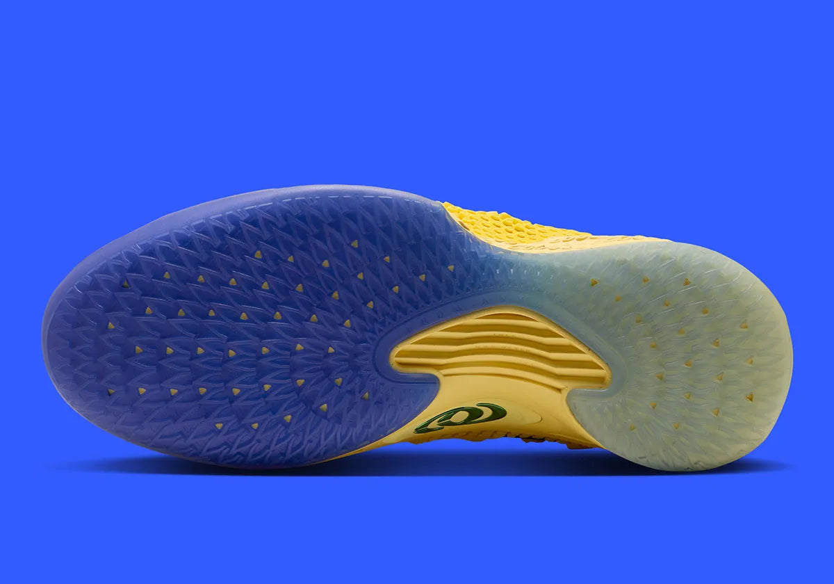 Nike Caitlin 1 Warning Code IH7423-700 jaune Yellow Zest et Racer Blue avec empeigne Opticast, Air Zoom Turbo et logo Caitlin Clark.