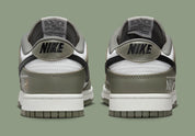 Nike Dunk Low NBA Paris, sneaker Nike Dunk Low inspirée de la NBA et de Paris avec une silhouette emblématique et des finitions premium vue de profil. 