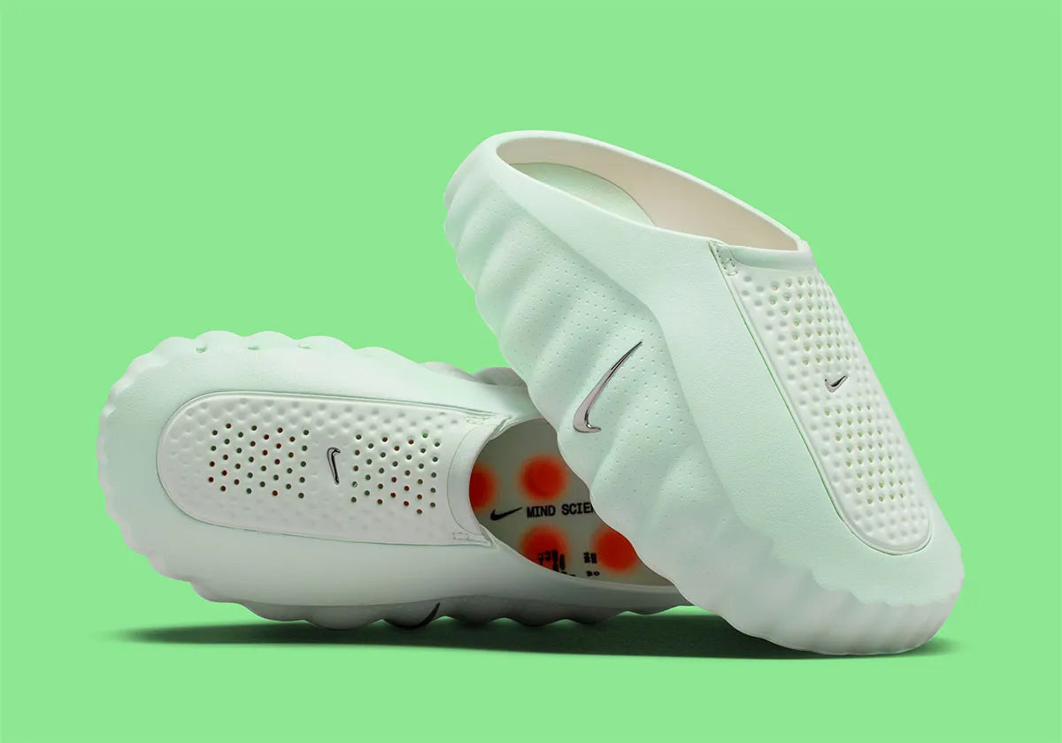 Nike Mind 001 Barely Green Hyper Crimson Black Chrome, sneaker Nike aux teintes vert pâle, orange, noir et chrome avec design moderne et finitions premium.