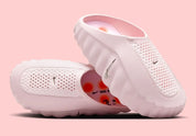 Claquette Nike Mind 001 Slide Pearl Pink rose nacré en mousse technique avec pods sensoriels et design sculpté moderne.