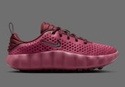 Nike Mind 002 Pink Smoke Mystic Dates avec tige en textile technique rose fumé, détails aux nuances terreuses et semelle moderne offrant confort et adhérence.
