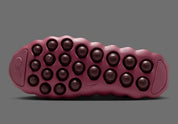 Nike Mind 002 Pink Smoke Mystic Dates avec tige en textile technique rose fumé, détails aux nuances terreuses et semelle moderne offrant confort et adhérence.
