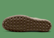 Nike Moon Shoe OG SP Sail Chlorophyll, sneaker Nike rétro-running crème et verte avec Swoosh latéral et semelle Waffle inspirée des années 1970.