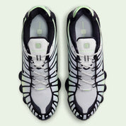 Nike Shox TL Vapor Green Black noires avec détails vert Vapor Green et amorti Nike Shox sur toute la longueur.