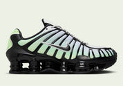 Nike Shox TL Vapor Green Black noires avec détails vert Vapor Green et amorti Nike Shox sur toute la longueur.