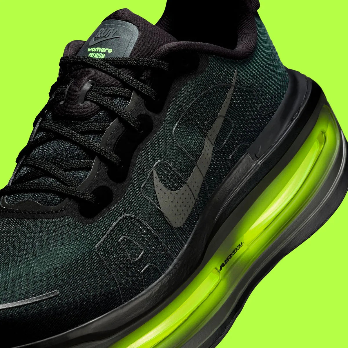 Sneakers Nike Vomero Premium en Black et Volt avec mesh respirant et amorti Zoom Air premium.