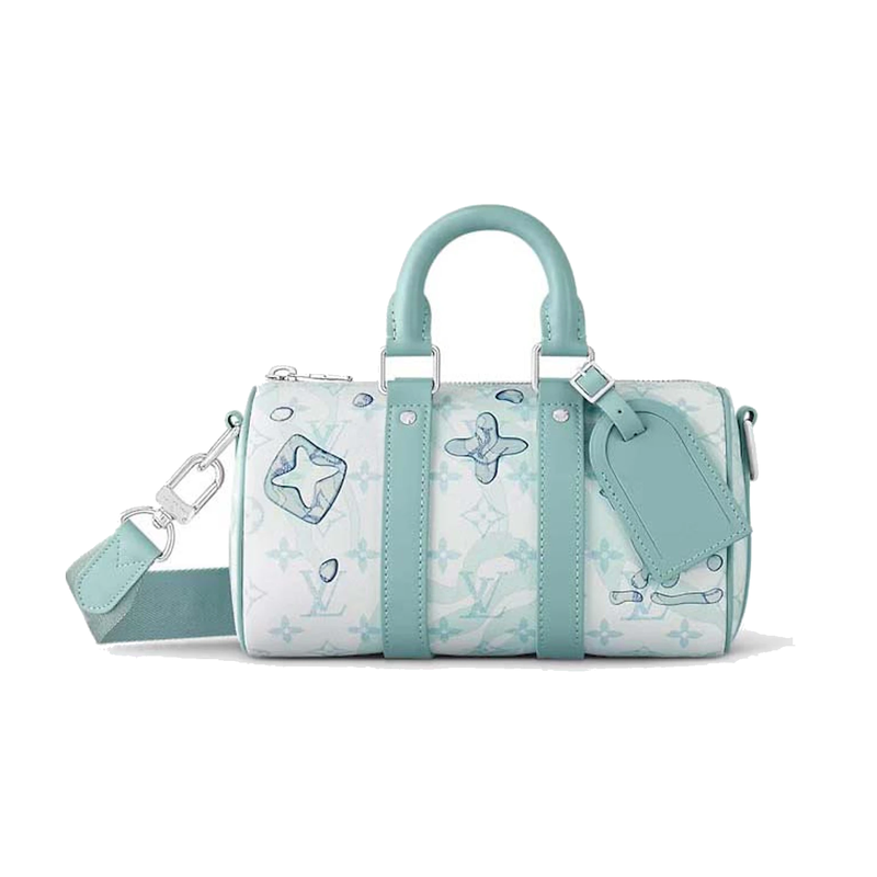 Louis Vuitton Keepall Bandoulière 25 Crystal Blue en cuir de veau grainé embossé Monogram bleu Crystal Blue avec poignées roulées, bandoulière amovible, fermeture zippée et finitions métalliques.