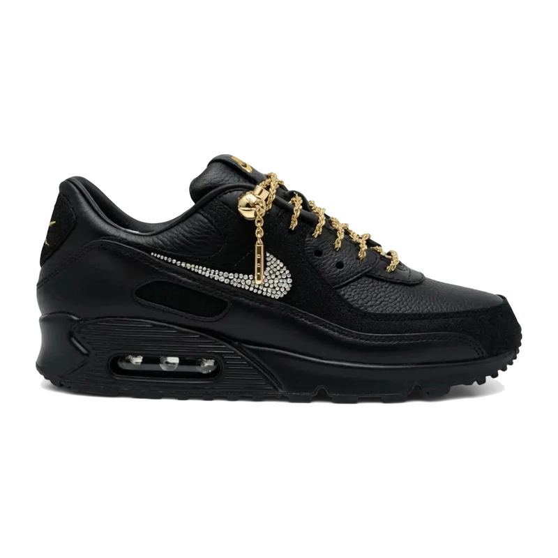 Nike Air Max 90 Victor Solomon ASW Black avec tige en cuir premium noir, empiècements texturés, unité Max Air visible au talon et semelle extérieure en caoutchouc gaufré vue de profil. 