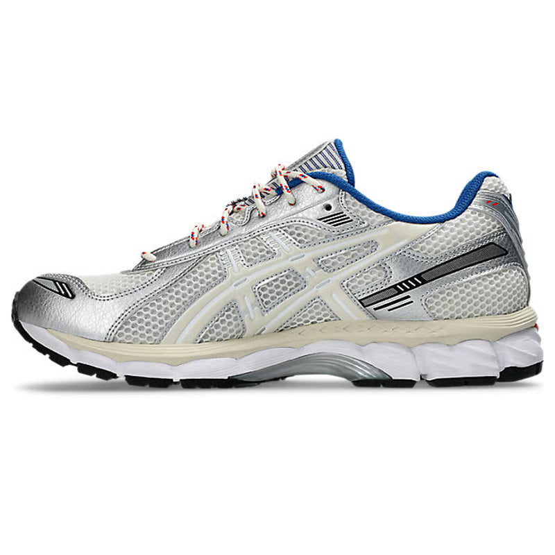 ASICS Gel-Kayano 12.1 Ronnie Fieg Knicks en mesh bleu, orange et blanc avec amorti GEL, détails premium et design rétro-running collector.