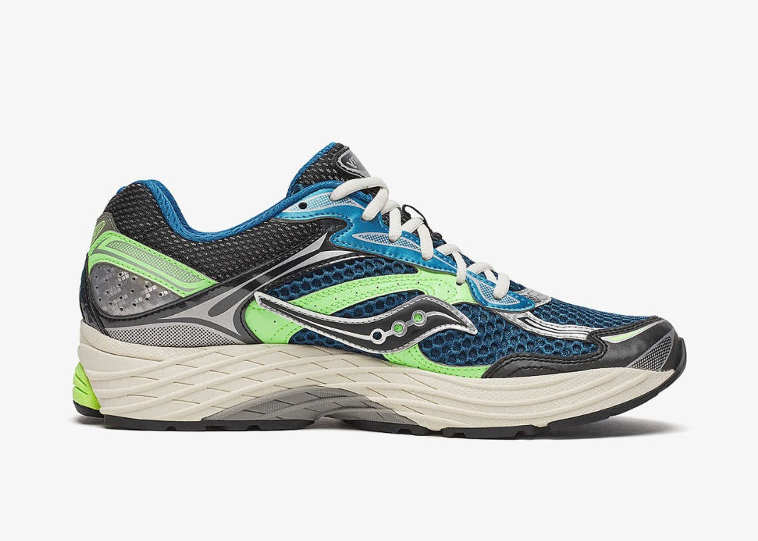 Saucony ProGrid Omni 9 Blue Lime en mesh respirant avec détails bleus et lime, amorti ProGrid vue de profil intérieur. 