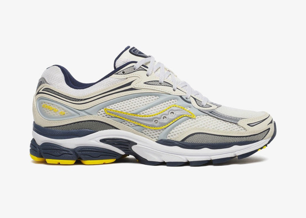 Saucony ProGrid Omni 9 Fabricated Future Pack White Yellow en mesh blanc avec touches jaunes et amorti ProGrid vue de profil