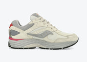 Saucony ProGrid Omni 9 Premium Ivory Grey Pink en mesh ivoire avec détails gris et roses, amorti ProGrid vue de profil intérieur. 
