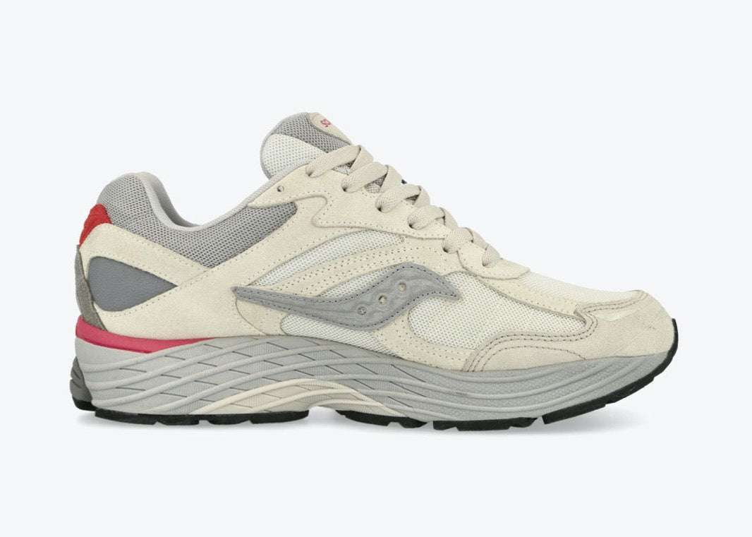 Saucony ProGrid Omni 9 Premium Ivory Grey Pink en mesh ivoire avec détails gris et roses, amorti ProGrid vue de profil intérieur. 