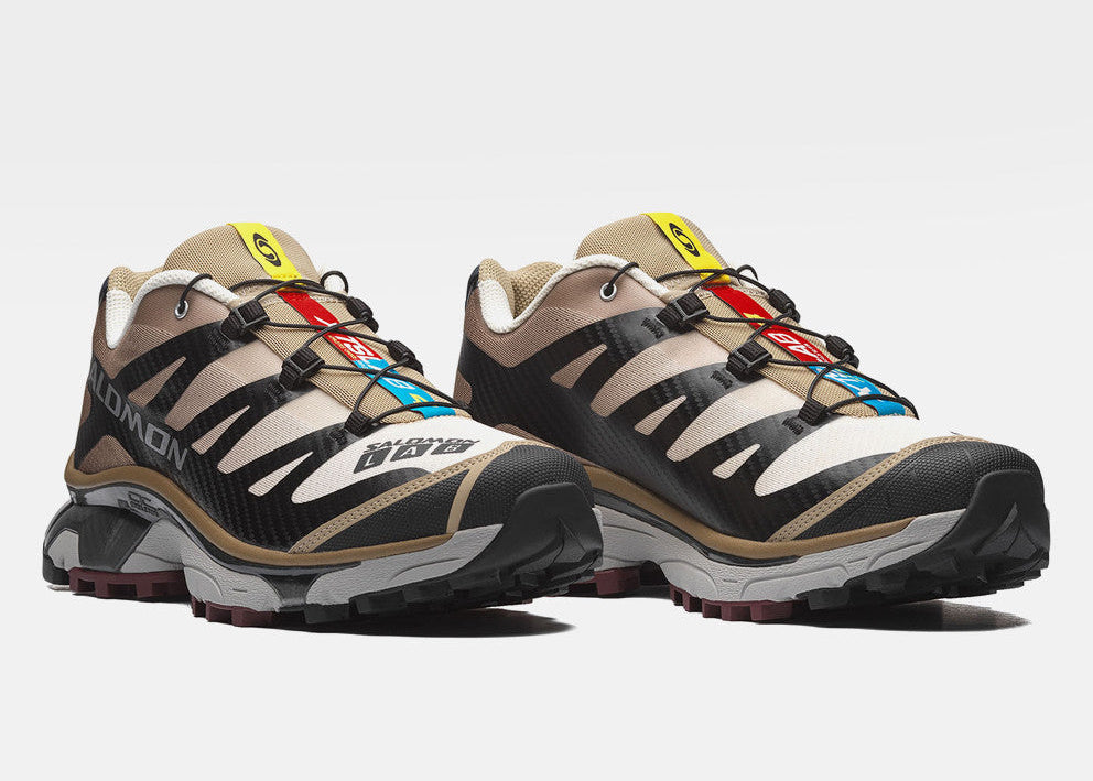 Salomon XT-4 OG Black Desert Tan L49217100 en noir avec détails beige Desert Tan et Vanilla Ice, semelle technique et châssis Agile Chassis™.