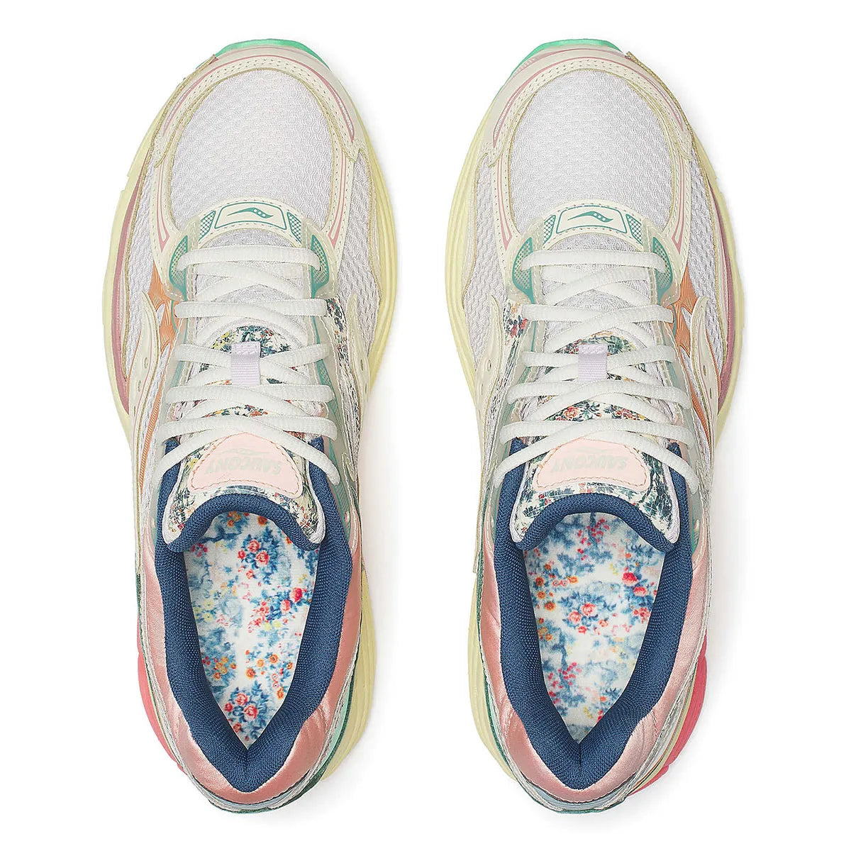 Sneaker Saucony ProGrid Omni 9 beige avec détails bleus floraux en mesh respirant et semelle amortissante ProGrid