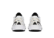 Saucony Ride Millennium blanche avec détails dorés et noirs, mesh respirant et semelle amortie GRID.Vue arrière 