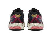 Saucony ProGrid Omni 9 Autumnal Equinox, sneaker running rétro multicolore avec mesh ouvert, accents métalliques irisés et semelle Grid vue de derrière. 