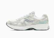 Saucony ProGrid Guide 7 Spiritual Guidance White Verde avec tige en mesh blanc, empiècements verts et cuir, technologie ProGrid et semelle extérieure en caoutchouc.