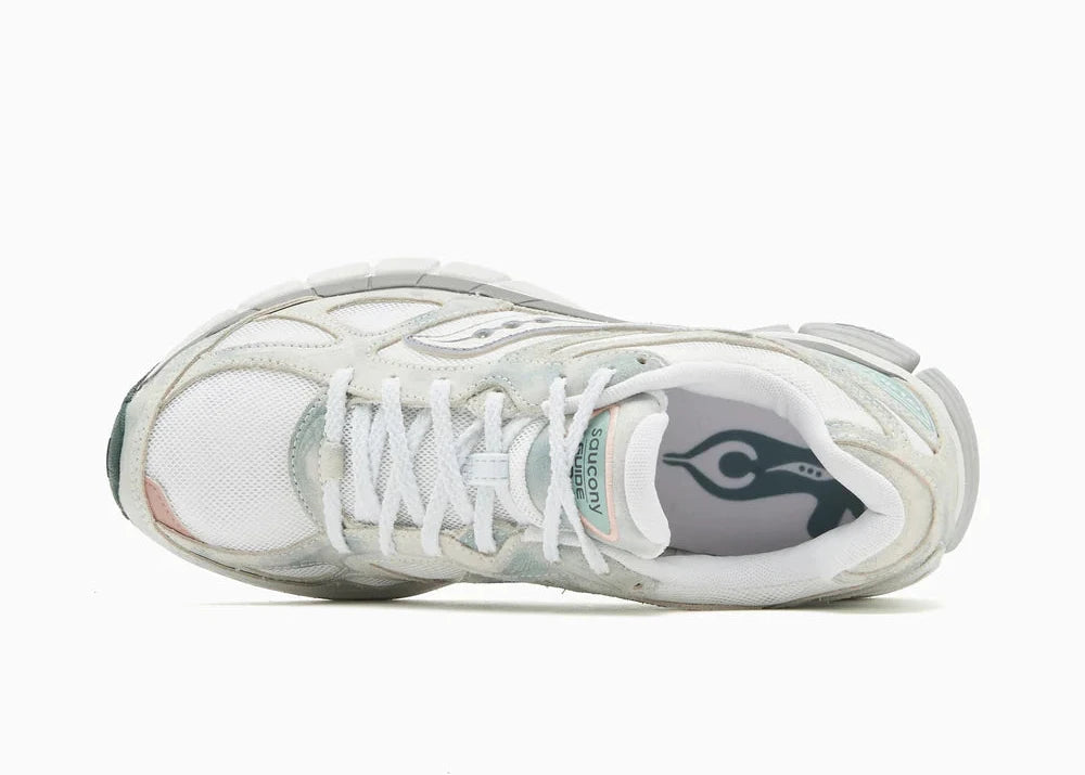 Saucony ProGrid Guide 7 Spiritual Guidance White Verde avec tige en mesh blanc, empiècements verts et cuir, technologie ProGrid et semelle extérieure en caoutchouc.