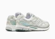 Saucony ProGrid Guide 7 Spiritual Guidance White Verde avec tige en mesh blanc, empiècements verts et cuir, technologie ProGrid et semelle extérieure en caoutchouc.