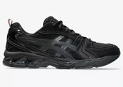 Sneakers ASICS Gel-Kayano 14 Thom Browne Black en mesh noir et cuir premium avec amorti GEL™ et détails tricolores signature vue de profil. 