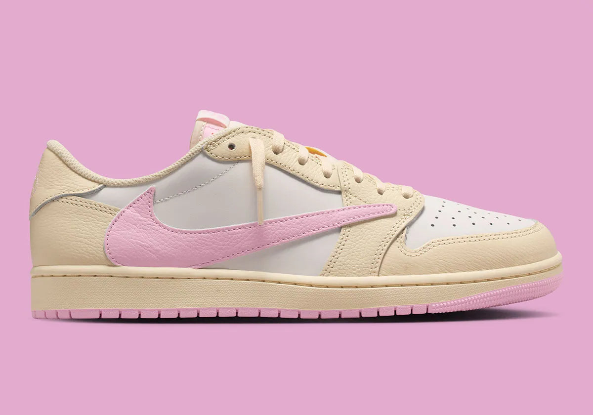 Air Jordan 1 Low Travis Scott en Shy Pink et cuir premium, avec Reverse Swoosh signature et finition collector exclusive.
