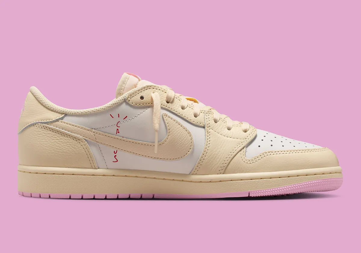 Air Jordan 1 Low Travis Scott en Shy Pink et cuir premium, avec Reverse Swoosh signature et finition collector exclusive.