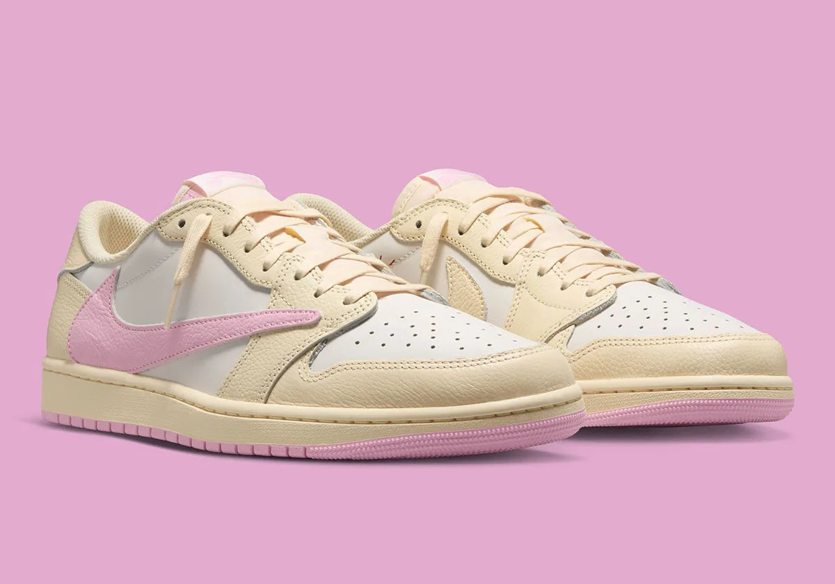 Air Jordan 1 Low Travis Scott en Shy Pink et cuir premium, avec Reverse Swoosh signature et finition collector exclusive.