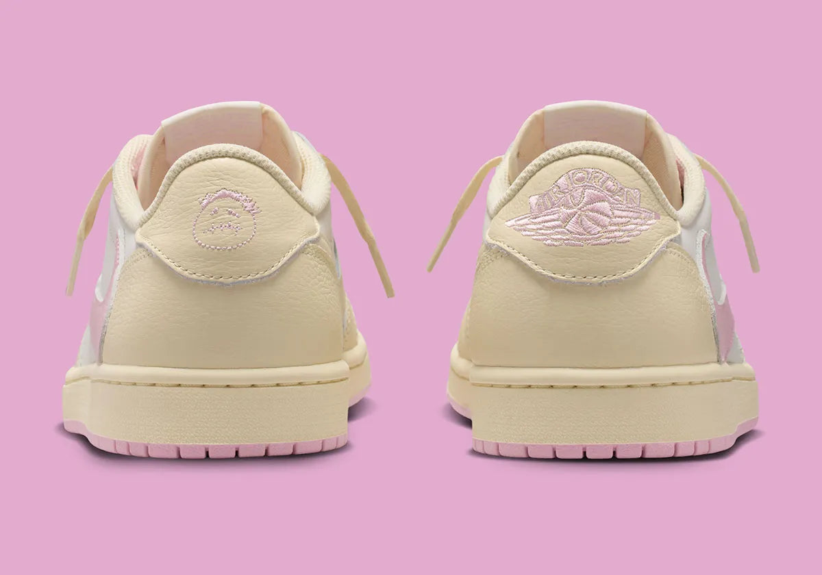 Air Jordan 1 Low Travis Scott en Shy Pink et cuir premium, avec Reverse Swoosh signature et finition collector exclusive.