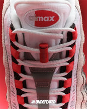 Sneakers Nike Air Max 95 SP Undefeated Geo Tokyo Bright Crimson rouges et noires en matières premium avec amorti Air Max visible et design graphique exclusif. Zoom avant 